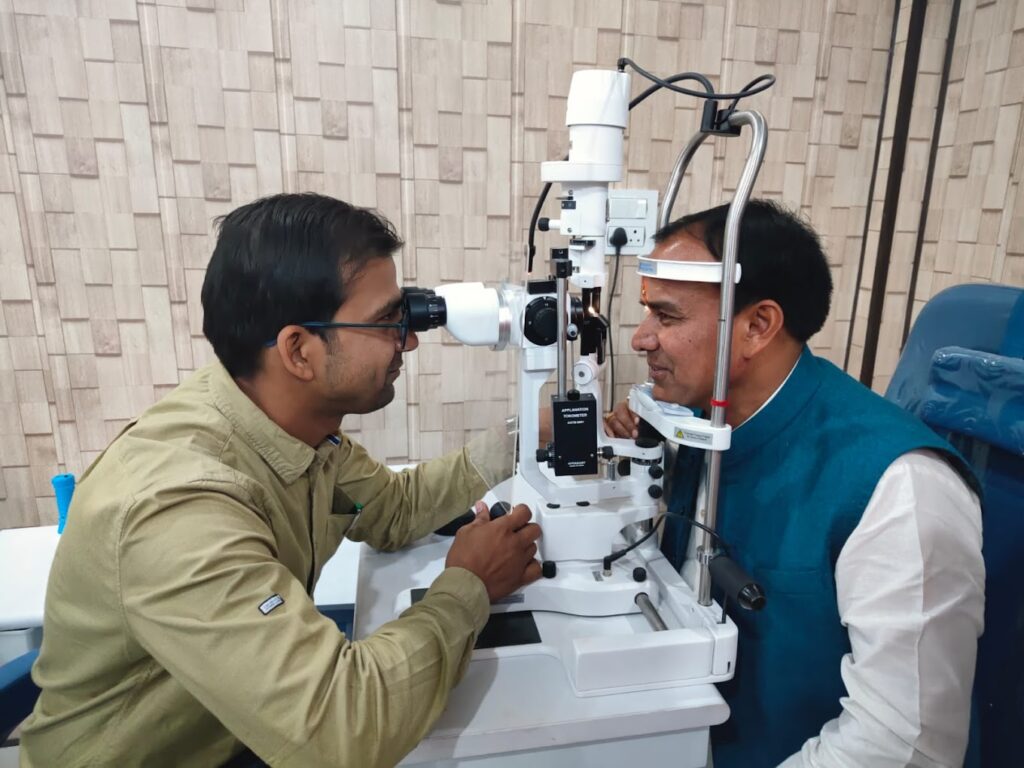 Dr. Dhan Singh Rawat, Education and Health Minister of Uttarakhand, standing inside Seemant Hospital, Pithoragarh, during an official visit. He is seen interacting with medical staff and foundation members.