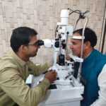 Dr. Dhan Singh Rawat, Education and Health Minister of Uttarakhand, standing inside Seemant Hospital, Pithoragarh, during an official visit. He is seen interacting with medical staff and foundation members.