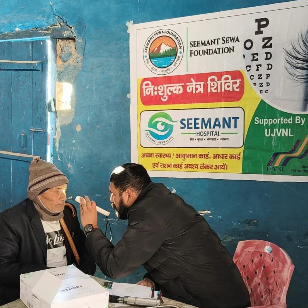 Vision testing during free eye healthcare camp by Seemant Sewa Foundation