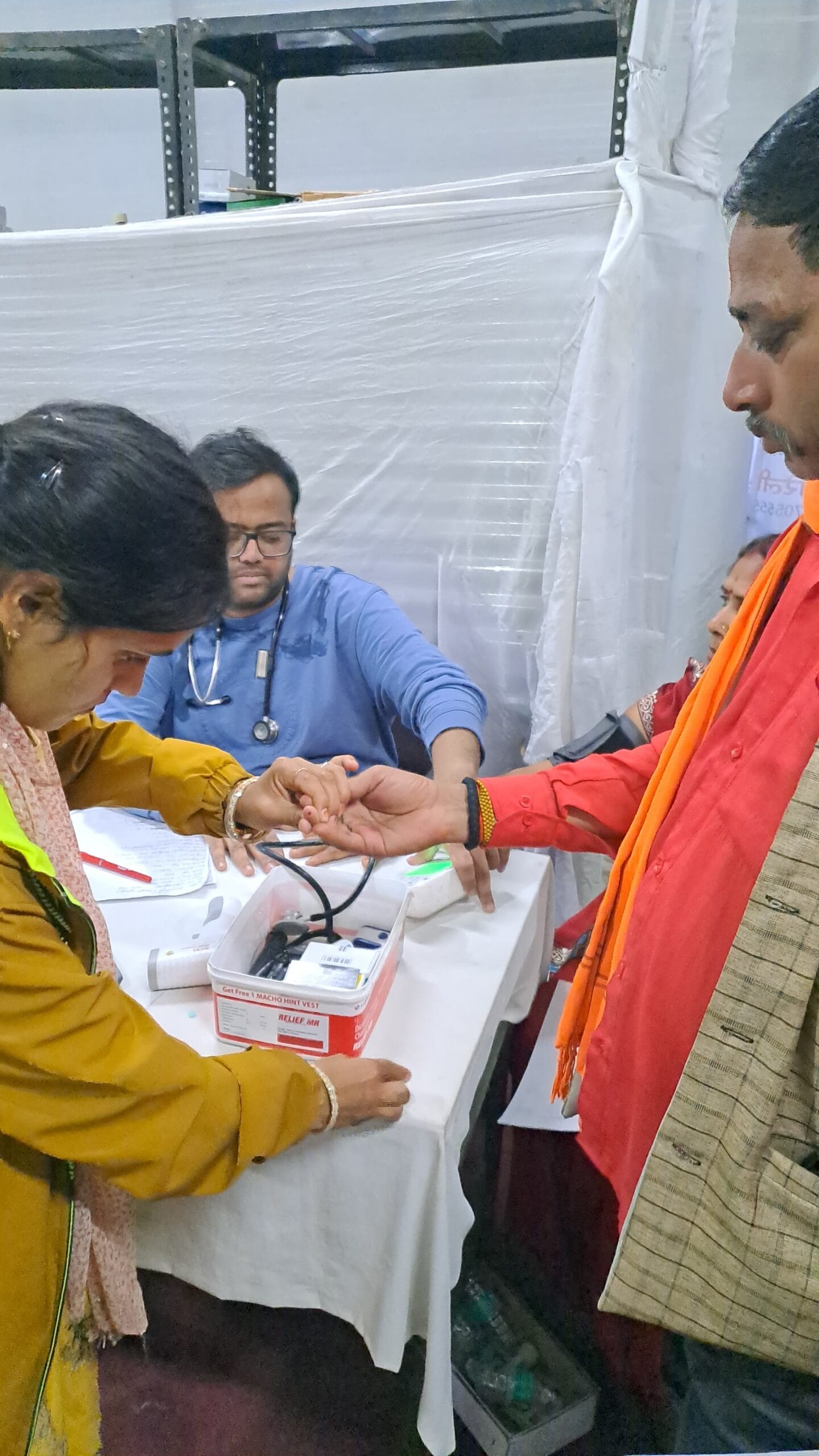Patients receiving healthcare support at Maa Purnagiri free medical camp in Uttarakhand