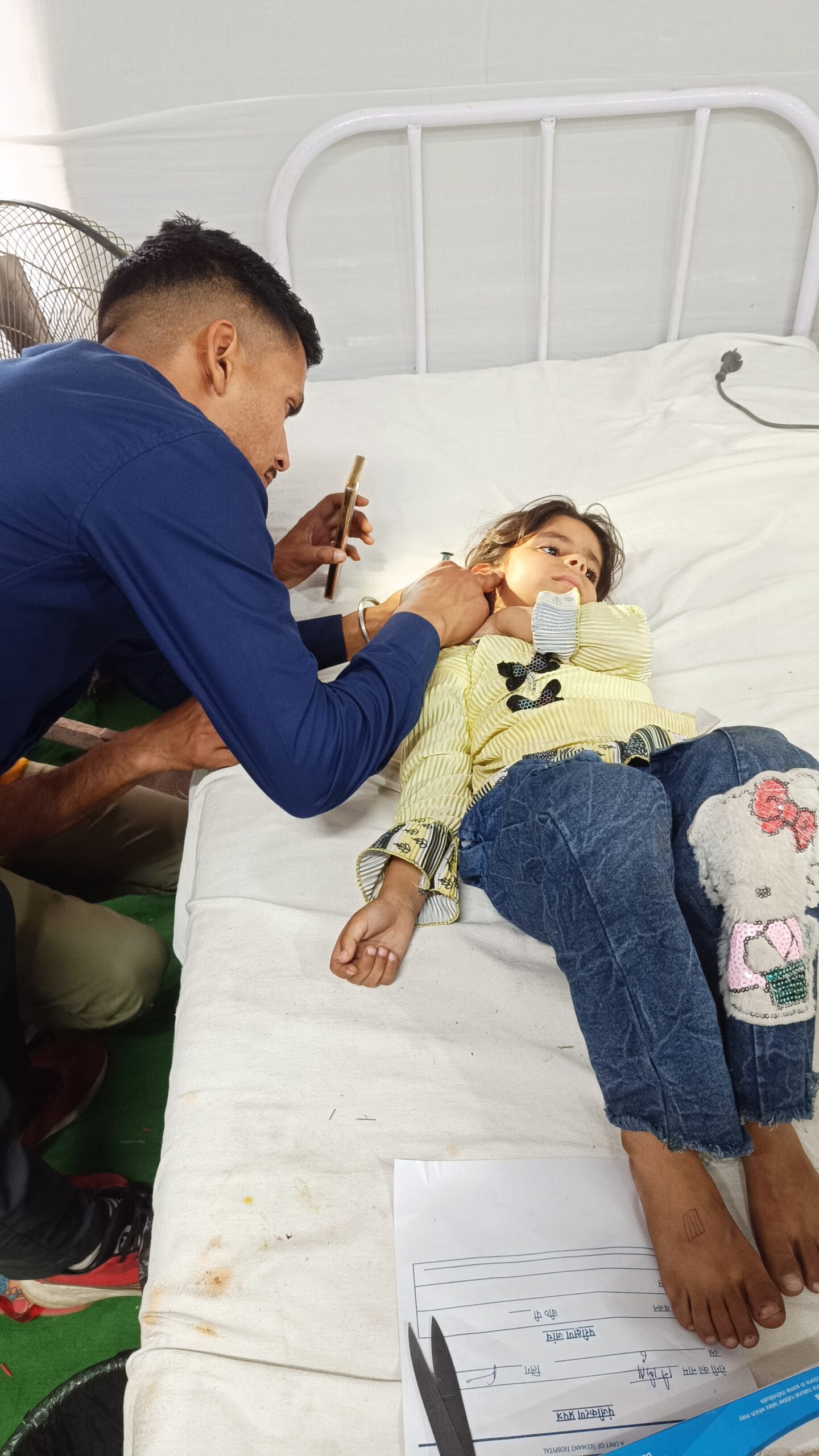 Doctors providing IV fluid support during Maa Purnagiri Medical Camp in Uttarakhand